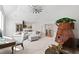 Bonus room featuring bright neutral colors, a large sectional sofa, a ceiling fan, and a treehouse themed area at 7212 Summer Tanager Trl, Raleigh, NC 27614
