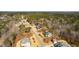 Wide aerial view showing homes in the surrounding neighborhood and wooded areas at 7212 Summer Tanager Trl, Raleigh, NC 27614