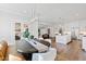 Spacious dining room featuring modern lighting and a large island, blending with a well-equipped kitchen at 7212 Summer Tanager Trl, Raleigh, NC 27614