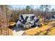 A charming two-story home boasts a three-car garage, manicured lawn, and beautifully landscaped yard at 7212 Summer Tanager Trl, Raleigh, NC 27614
