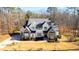 A charming two-story home boasts a two-car garage, long driveway, and beautifully landscaped yard at 7212 Summer Tanager Trl, Raleigh, NC 27614