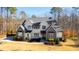 A charming two-story home boasts a two-car garage, manicured lawn, and beautifully landscaped yard at 7212 Summer Tanager Trl, Raleigh, NC 27614