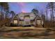 Beautiful two-story home boasting a landscaped front yard, neutral exterior color palette, and architectural shingles at 7212 Summer Tanager Trl, Raleigh, NC 27614