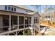 Charming home featuring a screened porch and a backyard firepit area for outdoor enjoyment at 7212 Summer Tanager Trl, Raleigh, NC 27614