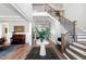 Grand foyer with high ceilings, a staircase, and elegant decor create a welcoming entrance at 7212 Summer Tanager Trl, Raleigh, NC 27614