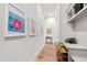 Hallway with a built-in desk and overhead storage, great for use as a home office or study space at 7212 Summer Tanager Trl, Raleigh, NC 27614