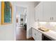 Stylish hallway featuring built-in cabinets and countertops, great for entertaining and serving refreshments at 7212 Summer Tanager Trl, Raleigh, NC 27614