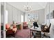 Charming home office with natural light, paneled walls, and comfortable seating areas at 7212 Summer Tanager Trl, Raleigh, NC 27614