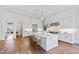 Beautiful kitchen with a central island, stainless steel appliances, and custom white cabinetry at 7212 Summer Tanager Trl, Raleigh, NC 27614
