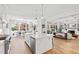 Bright, spacious kitchen with island seating and open layout to living and dining areas at 7212 Summer Tanager Trl, Raleigh, NC 27614
