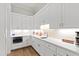 Well-appointed kitchen with stainless steel appliances, quartz countertops, and ample storage at 7212 Summer Tanager Trl, Raleigh, NC 27614