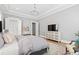 Comfortable main bedroom with elegant decor and a modern entertainment center, great for relaxation at 7212 Summer Tanager Trl, Raleigh, NC 27614