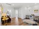 Office featuring hardwood floors, a round rug, neutral paint, a comfortable chair, and a desk at 7212 Summer Tanager Trl, Raleigh, NC 27614