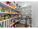 Organized walk-in pantry with ample shelving, providing lots of storage space for kitchen essentials at 7212 Summer Tanager Trl, Raleigh, NC 27614