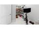 Pantry with open shelving units and exercise bike at 7212 Summer Tanager Trl, Raleigh, NC 27614