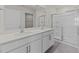 Bathroom with double vanity, sleek hardware, and glass-enclosed shower at 832 Canis Minor Rd, Wendell, NC 27591