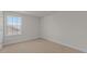 Bedroom with large window providing ample natural light at 832 Canis Minor Rd, Wendell, NC 27591