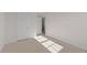 Bedroom featuring neutral carpet, trim, and two doors at 832 Canis Minor Rd, Wendell, NC 27591