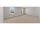 Spacious carpeted bedroom with dual windows providing plenty of natural light at 832 Canis Minor Rd, Wendell, NC 27591