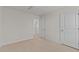 Bedroom featuring neutral carpet, trim, and doors at 832 Canis Minor Rd, Wendell, NC 27591