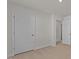 Bright, carpeted bedroom featuring closet and doorway at 832 Canis Minor Rd, Wendell, NC 27591
