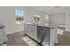 Stylish kitchen island featuring granite countertops, ample storage, and stainless steel dishwasher at 832 Canis Minor Rd, Wendell, NC 27591