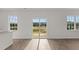 Living room featuring a view of the backyard through sliding doors at 832 Canis Minor Rd, Wendell, NC 27591