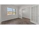 Bright living room with a large window and French doors, offering a versatile space at 832 Canis Minor Rd, Wendell, NC 27591