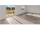 Bright living room with sliding glass doors to the deck and a large picture window at 832 Canis Minor Rd, Wendell, NC 27591