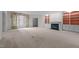 Bright living room with a fireplace, built-in shelving, and large windows at 100 Edenburgh Rd # 202, Raleigh, NC 27608