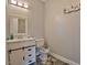 Charming bathroom featuring a white vanity, Paw Patrol themed rug and gray tiling at 1012 Cook Rd, Durham, NC 27713