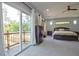 Bedroom with a sliding glass door leading to a balcony with scenic outdoor views at 1012 Cook Rd, Durham, NC 27713