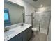 Modern bathroom with double vanity and glass-enclosed shower at 10523 Brookside Reserve Rd, Raleigh, NC 27614