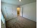 Cozy carpeted bedroom with closet and natural light at 10523 Brookside Reserve Rd, Raleigh, NC 27614
