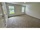 Comfortable carpeted bedroom with plenty of natural light at 10523 Brookside Reserve Rd, Raleigh, NC 27614