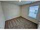 Simple bedroom features carpeted floors and bright window at 10523 Brookside Reserve Rd, Raleigh, NC 27614