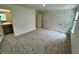 Spacious carpeted bedroom with walk-in closets and ample natural light at 10523 Brookside Reserve Rd, Raleigh, NC 27614