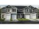 Charming townhome with multiple units, showcasing individual garages and a welcoming facade at 10523 Brookside Reserve Rd, Raleigh, NC 27614