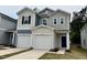 Charming two-story home with a two-car garage and well-maintained lawn at 10523 Brookside Reserve Rd, Raleigh, NC 27614