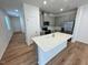 Modern kitchen with stainless steel appliances and a center island at 10523 Brookside Reserve Rd, Raleigh, NC 27614