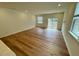 Spacious living room with hardwood floors and ample natural light at 10523 Brookside Reserve Rd, Raleigh, NC 27614