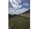 Expansive backyard featuring a wood deck and privacy fence, perfect for outdoor activities at 106 Bishop Ln, Dunn, NC 28334