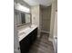 Bathroom with double sink vanity and tile flooring, providing ample space at 106 Bishop Ln, Dunn, NC 28334