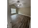 Bedroom features hard wood floors, neutral wall color and a ceiling fan, providing a comfortable and stylish aesthetic at 106 Bishop Ln, Dunn, NC 28334