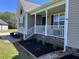 Charming home featuring a beautifully landscaped front yard with a cozy porch, adding curb appeal at 106 Bishop Ln, Dunn, NC 28334