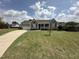 Charming home featuring a manicured lawn and a classic exterior design with an inviting front porch at 106 Bishop Ln, Dunn, NC 28334