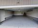 Clean, spacious garage with epoxy flooring and ample storage space at 106 Bishop Ln, Dunn, NC 28334