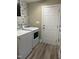 Convenient laundry area featuring modern washer and dryer with stylish patterned backsplash at 106 Bishop Ln, Dunn, NC 28334