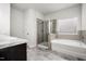Relaxing bathroom with tile floors, shower, soaking tub, and double vanity at 106 E Victory View. Ter, Smithfield, NC 27577