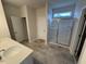 Modern bathroom featuring double sinks, a glass-enclosed shower, and tile flooring at 106 E Victory View. Ter, Smithfield, NC 27577